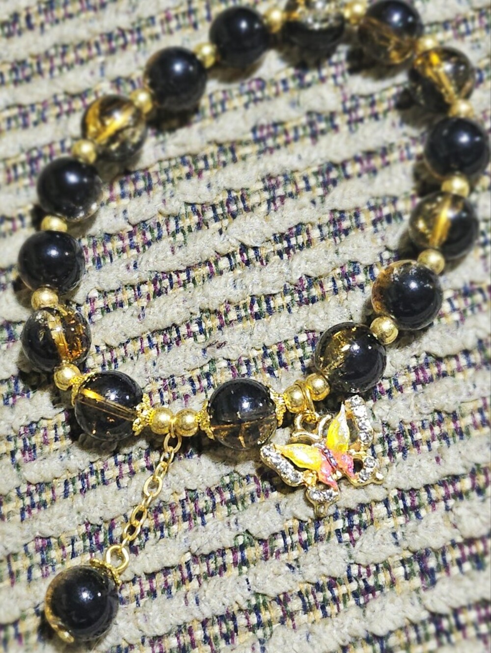 2/15$ Gold-Tone Black Bead Bracelet with Butterfly Accent